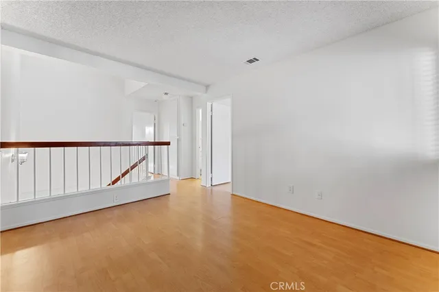 a view of an empty room with stairs
