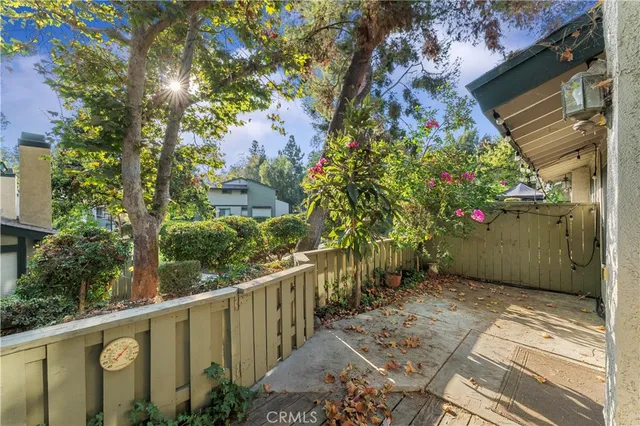a view of a house with a tree