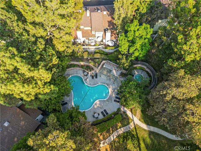 an aerial view of residential building and lake