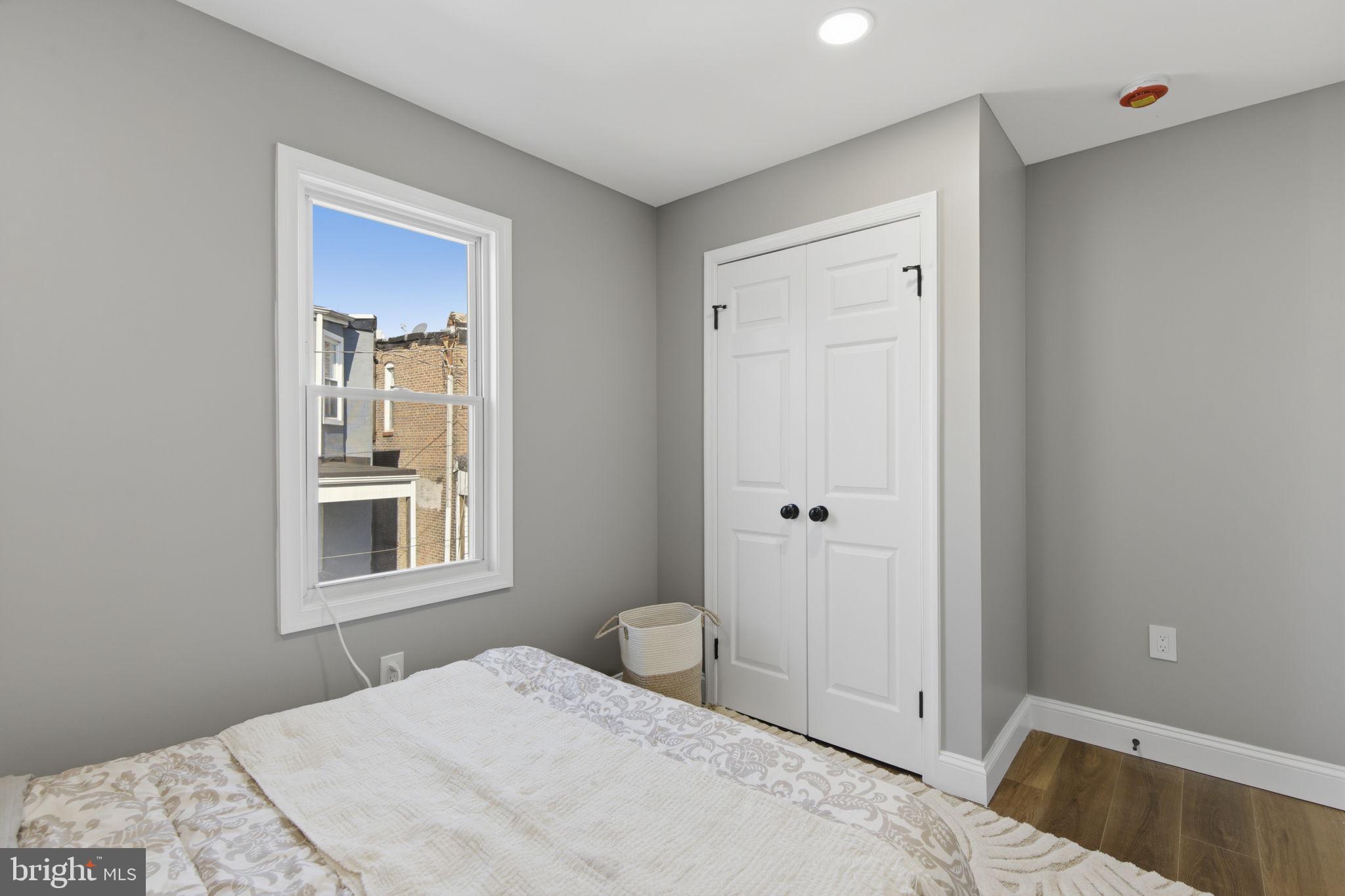 1600 Federal Street Baltimore, MD 21213 - Photo 15 of 31 a bedroom with a bed and a window