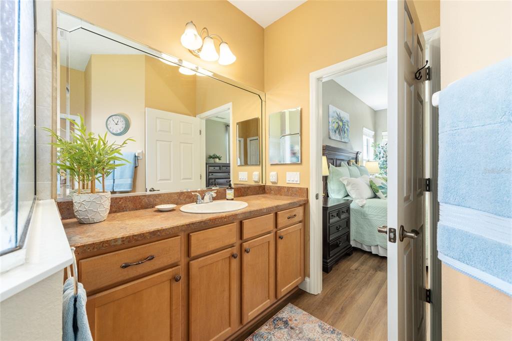 19639 Southwest 77th Loop Dunnellon, FL 34432 - Photo 35 of 59 a spacious bathroom with a granite countertop sink mirror and a