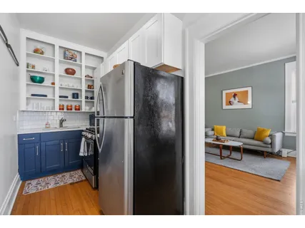 a kitchen with stainless steel appliances a refrigerator and a stove