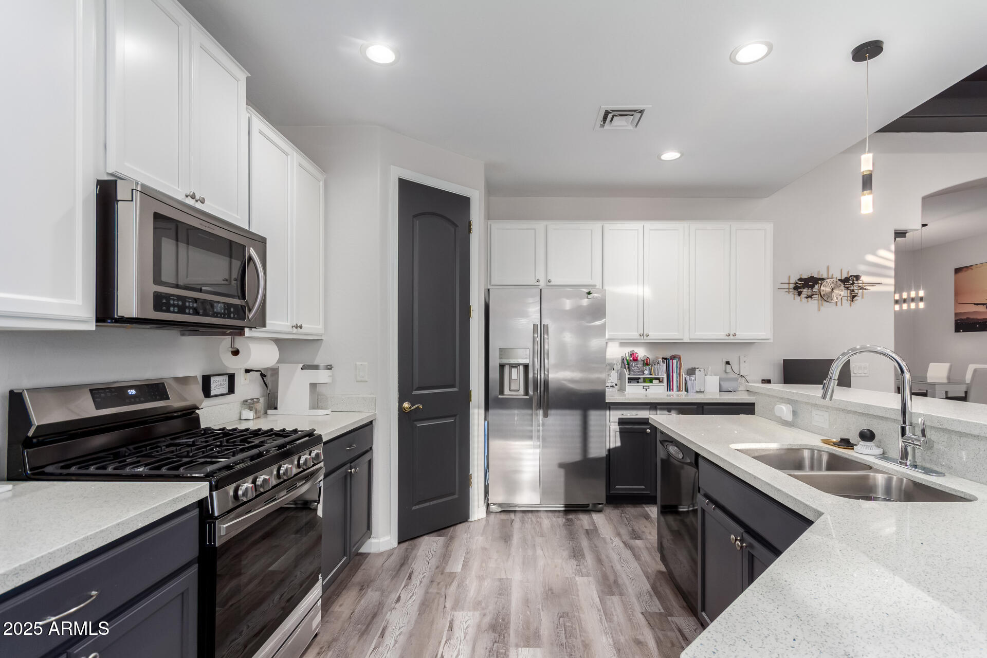 854 South Del Rio Court Apache Junction, AZ 85119 - Photo 24 of 57 a kitchen with a sink stove top oven and refrigerator