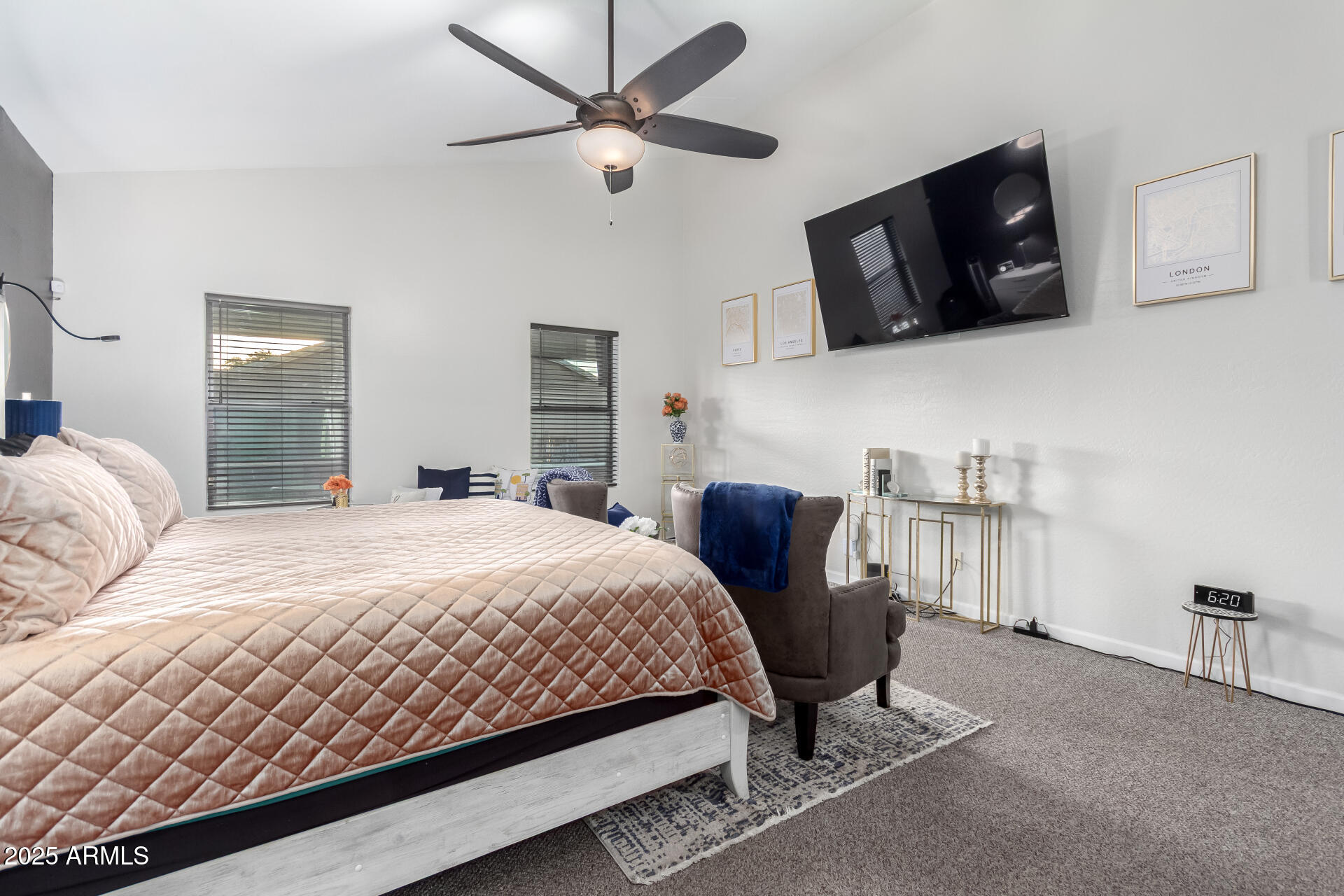 854 South Del Rio Court Apache Junction, AZ 85119 - Photo 28 of 57 a bedroom with a bed a mirror on dresser and a flat screen tv
