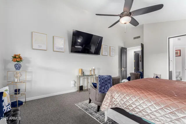 a bedroom with furniture and a window