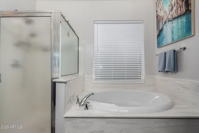 a bathroom with a granite countertop sink a toilet and a mirror