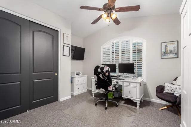 a view of a house with a big yard and a large tree