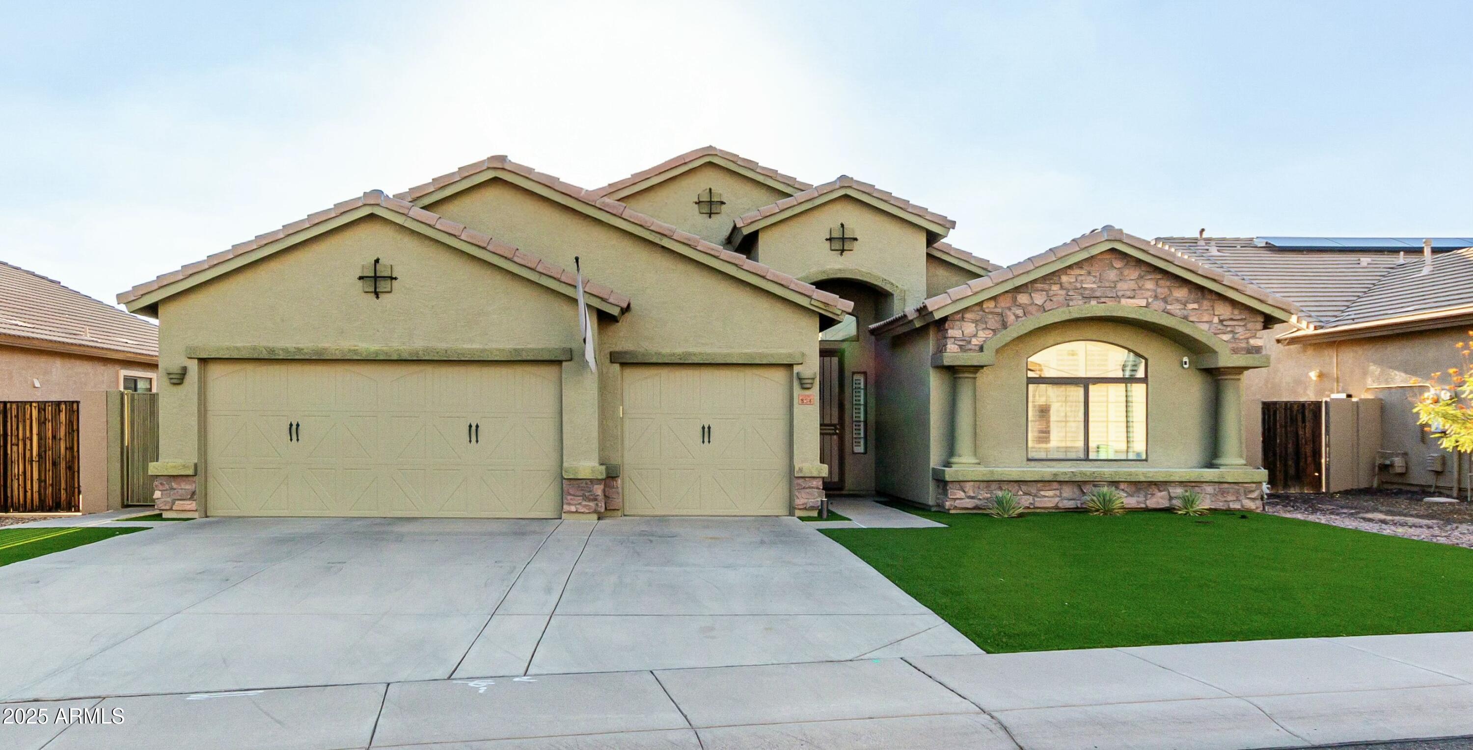 854 South Del Rio Court Apache Junction, AZ 85119 - Photo 6 of 57 a view of a big house with a small yard and plants