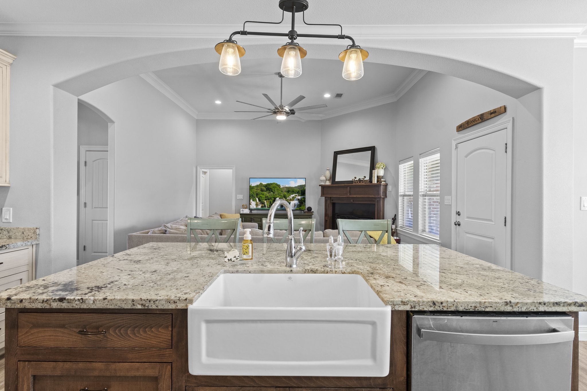 445 Bryant Boulevard Bridge City, TX 77611 - Photo 11 of 40 a kitchen with granite countertop a sink stainless steel appliances and chandelier