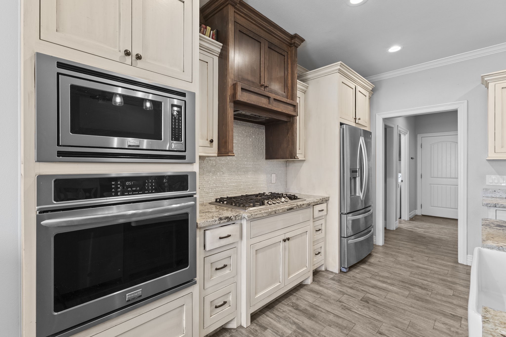 445 Bryant Boulevard Bridge City, TX 77611 - Photo 17 of 40 a kitchen with stainless steel appliances granite countertop a stove microwave and refrigerator