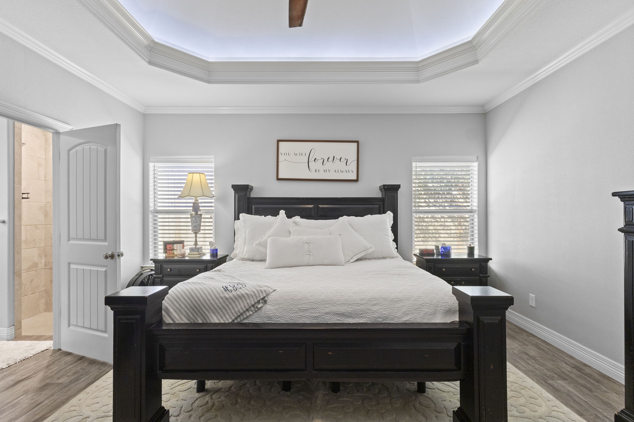 445 Bryant Boulevard Bridge City, TX 77611 - Photo 23 of 40 a large bed sitting in a bedroom next to a window with a lamp