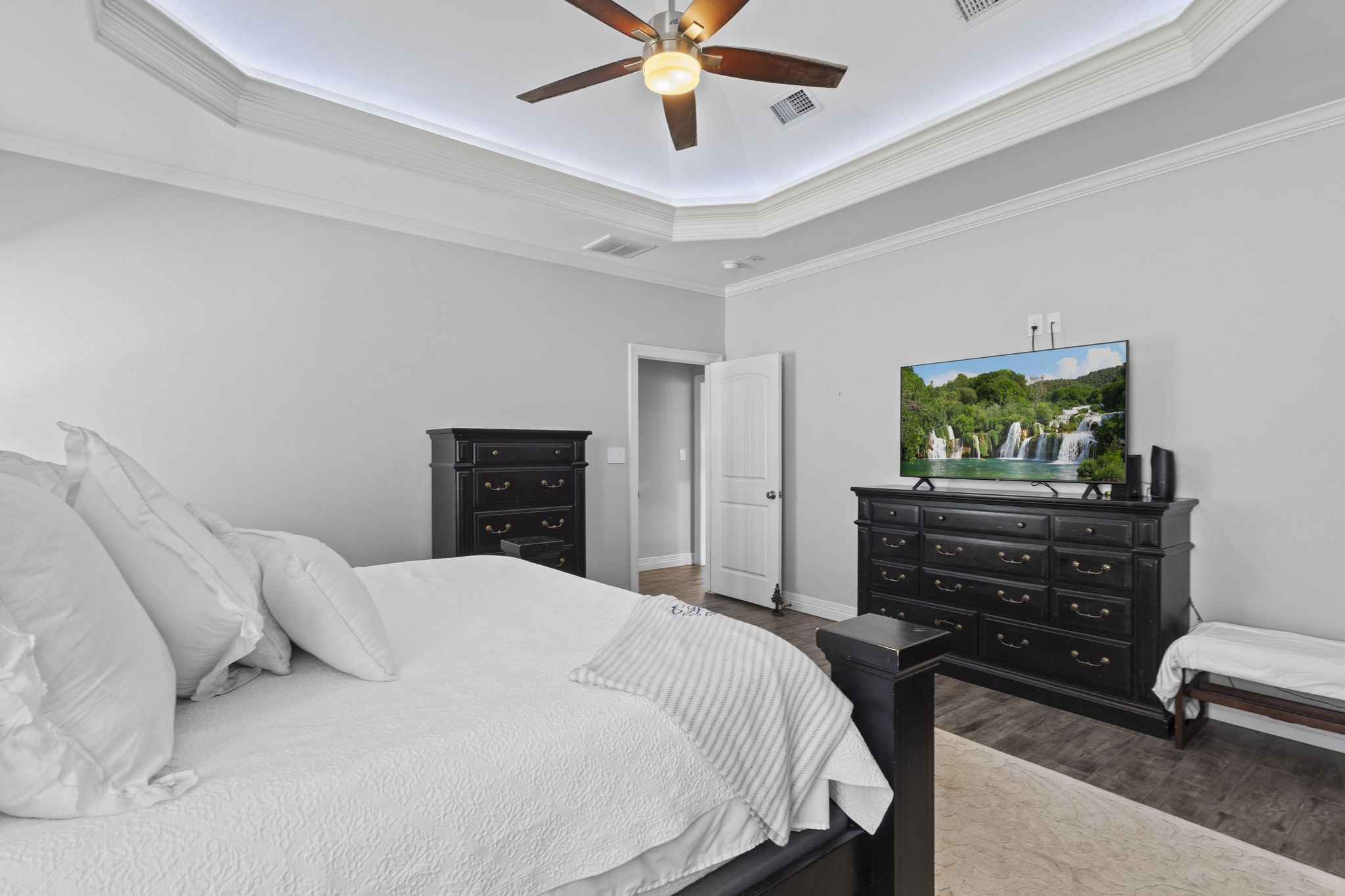 445 Bryant Boulevard Bridge City, TX 77611 - Photo 24 of 40 a bedroom with a bed and a chandelier