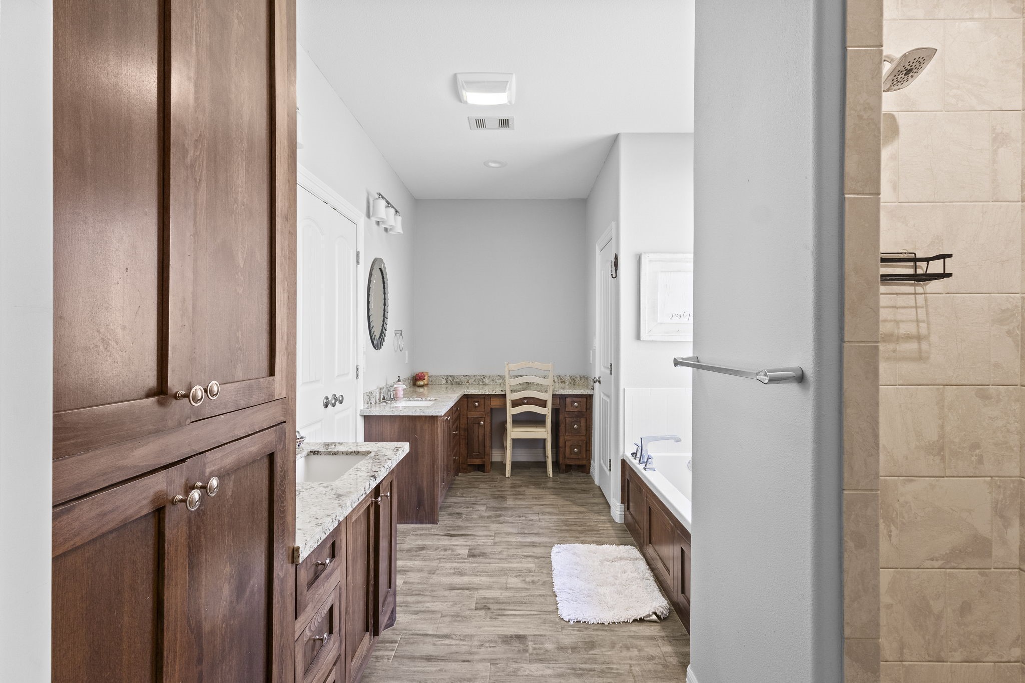 445 Bryant Boulevard Bridge City, TX 77611 - Photo 25 of 40 a large bathroom with a double vanity sink a mirror and a shower