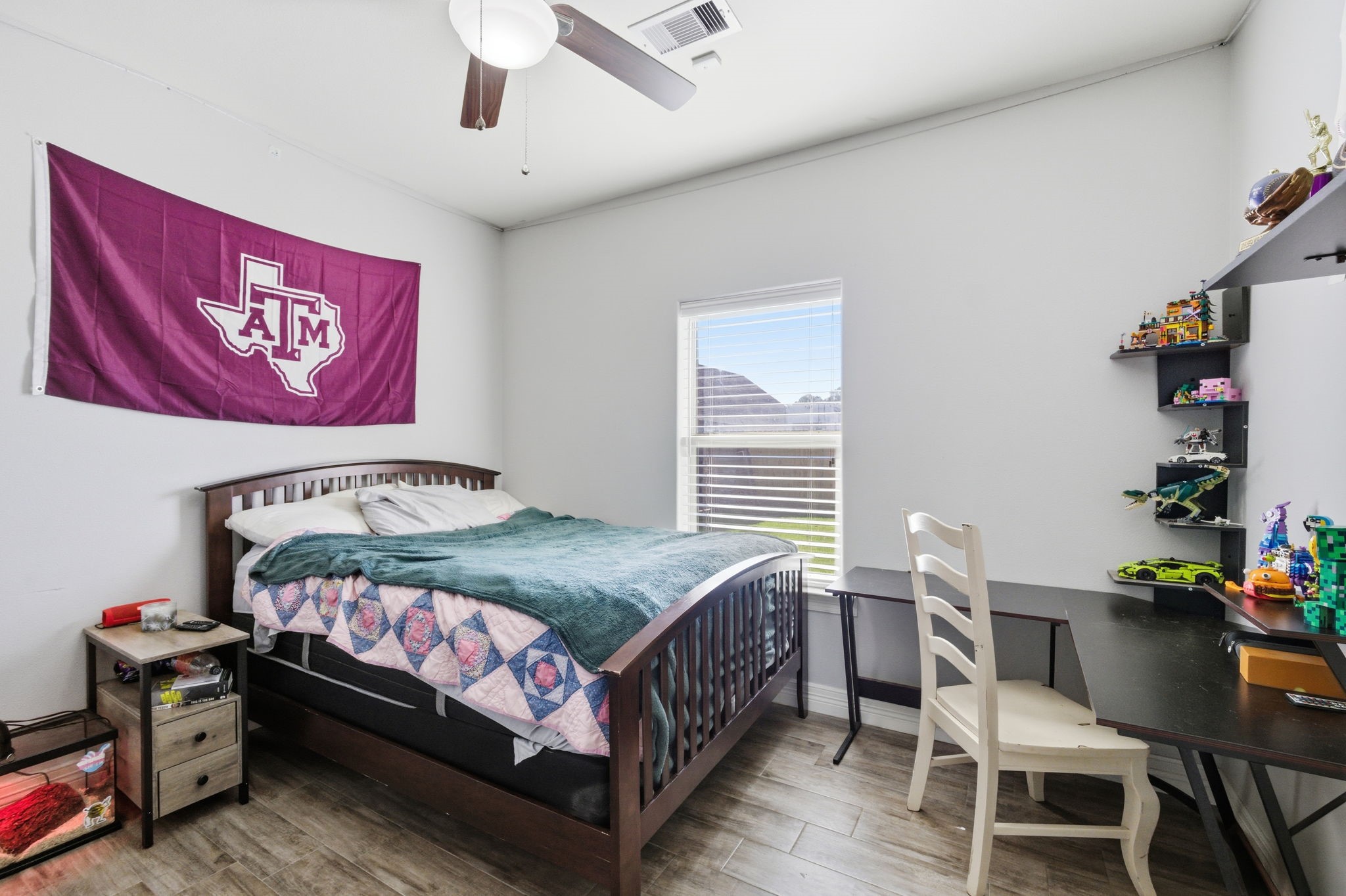 445 Bryant Boulevard Bridge City, TX 77611 - Photo 31 of 40 a bedroom with a bed table and chair