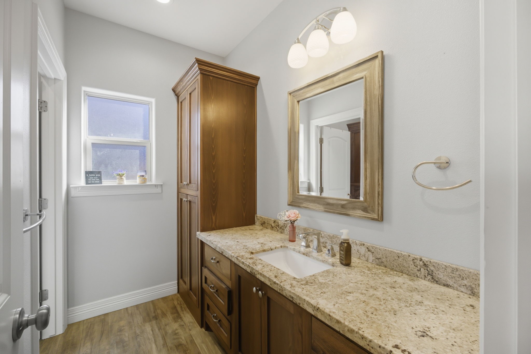 445 Bryant Boulevard Bridge City, TX 77611 - Photo 32 of 40 a bathroom with a granite countertop sink and a mirror