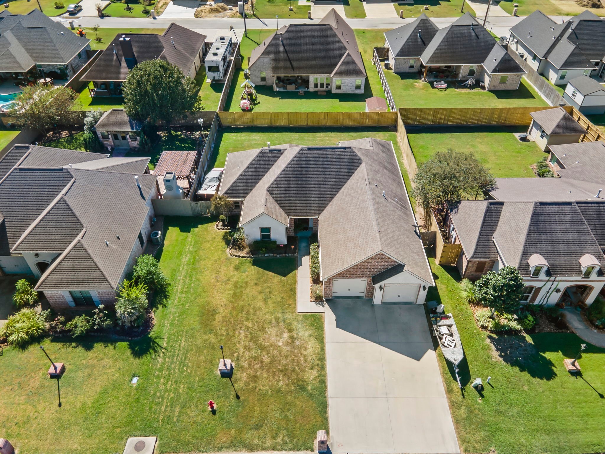 445 Bryant Boulevard Bridge City, TX 77611 - Photo 39 of 40 an aerial view of residential houses with outdoor space and a pool