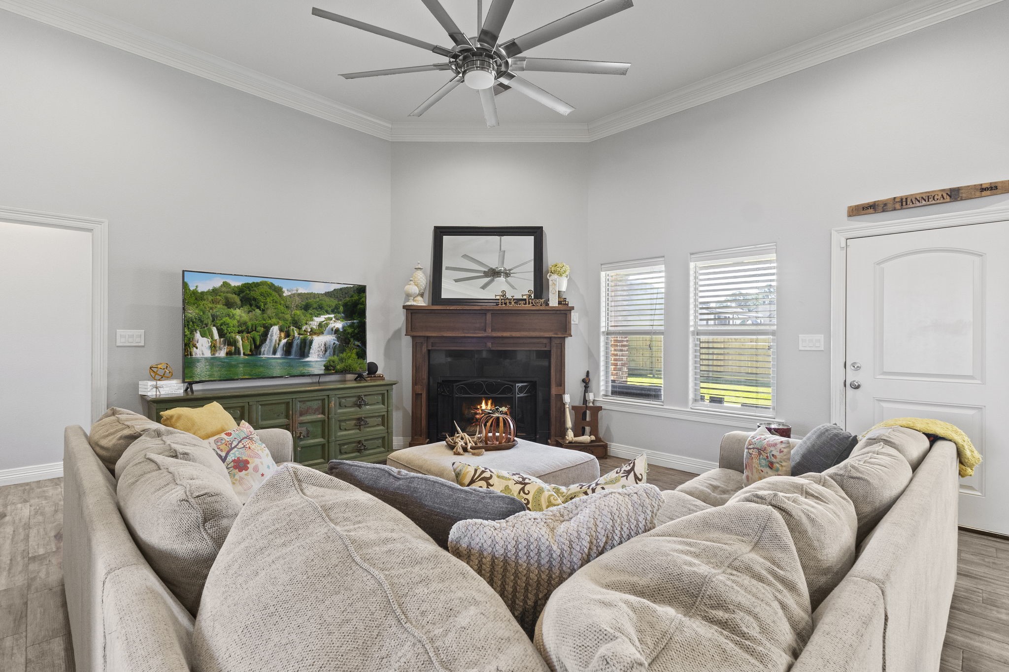445 Bryant Boulevard Bridge City, TX 77611 - Photo 6 of 40 a living room with furniture a fireplace and a flat screen tv