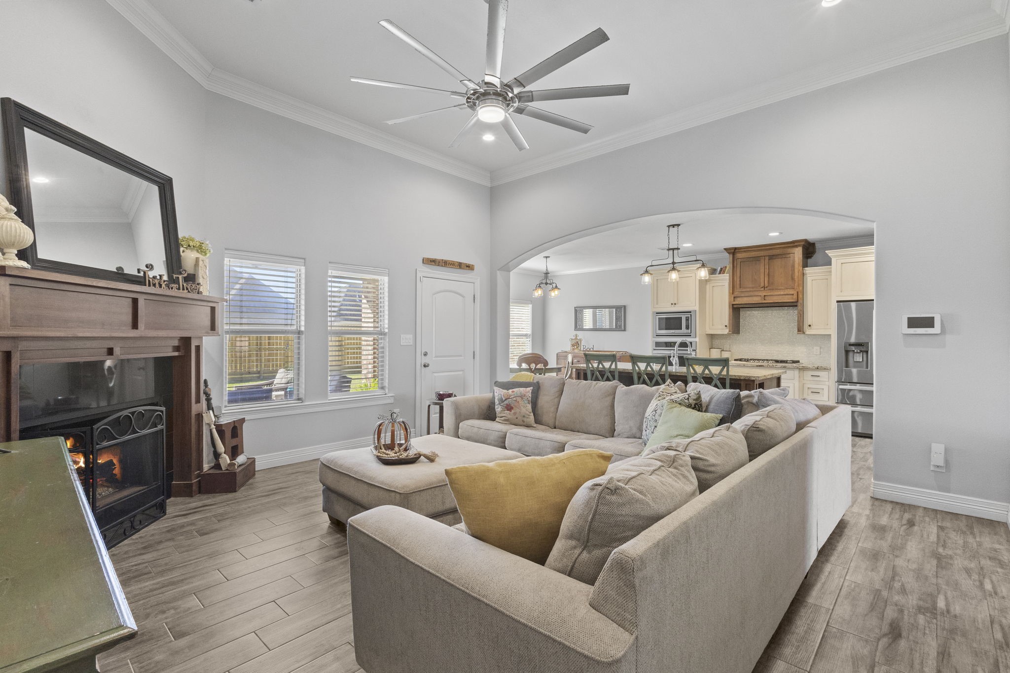 445 Bryant Boulevard Bridge City, TX 77611 - Photo 9 of 40 a living room with furniture a flat screen tv and a fireplace