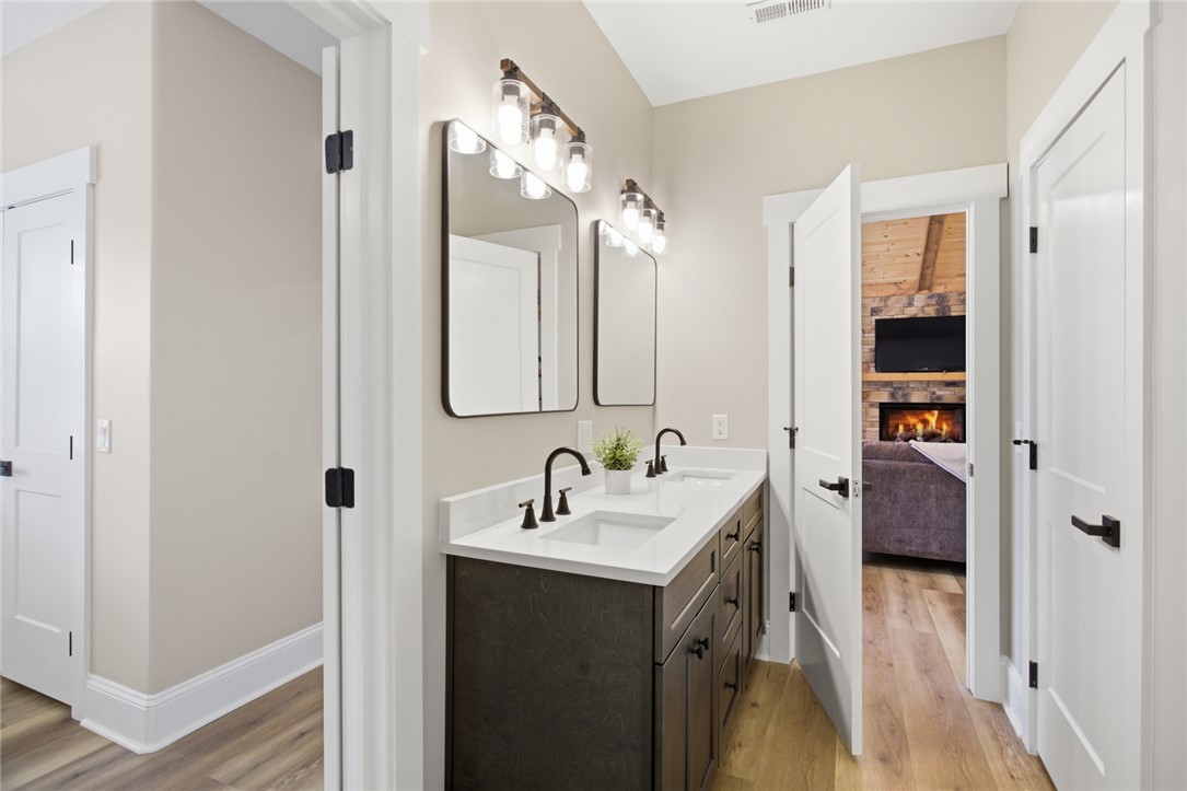 147 McAlister Road West Union, SC 29696 - Photo 22 of 49 This bathroom features a double vanity with ample storage, offering both style and functionality.