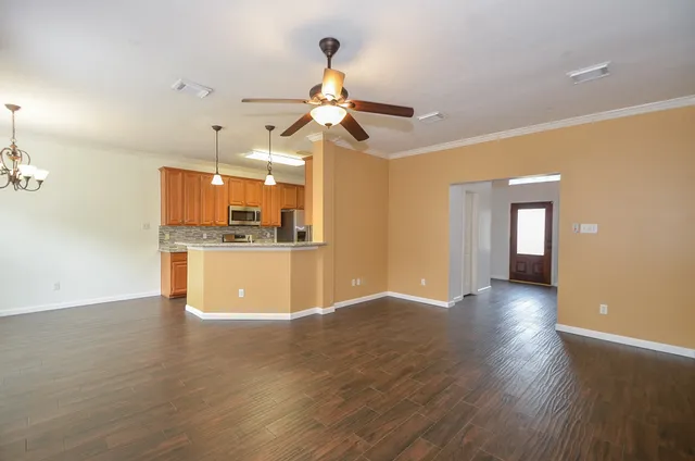a view of a kitchen with a sink and a window