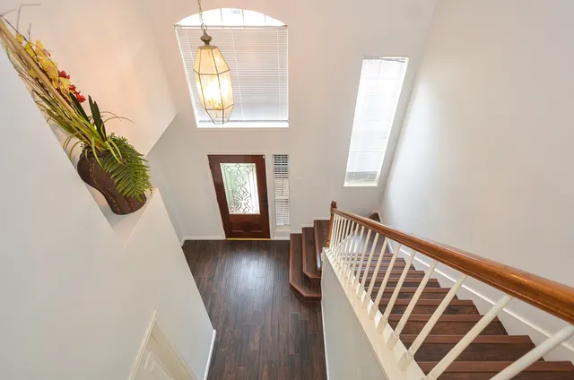 a view of entryway with wooden floor