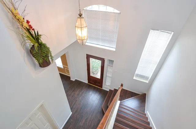 a view of an entryway with wooden floor
