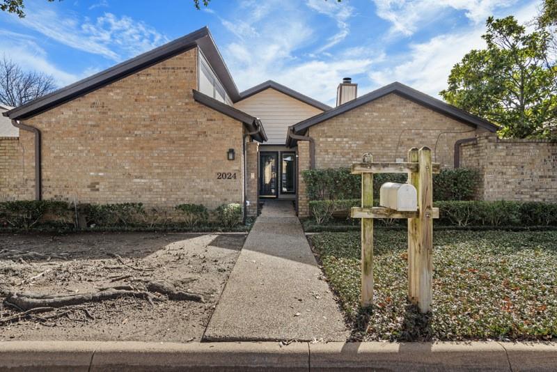 2024 Winter Sunday Way Arlington, TX 76012 - Photo 1 of 27 a front view of a house with garden