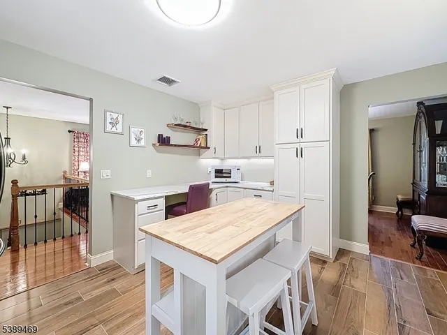 a kitchen with a stove a refrigerator and a sink