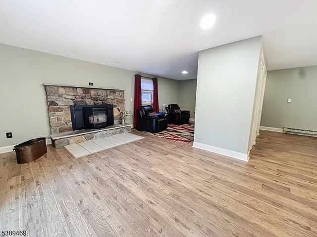 a bathroom with a sink mirror and toilet