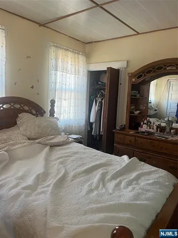 a porch with a table and chairs