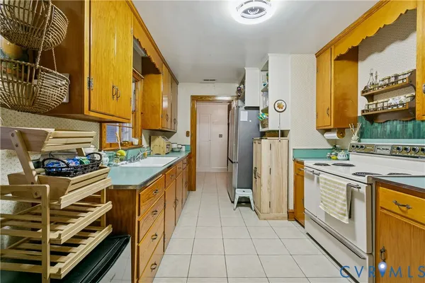 a kitchen with stainless steel appliances granite countertop a stove and a sink