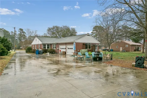a front view of a house with yard patio and green space