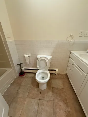 a bathroom with a toilet and a sink