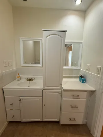 a bathroom with a sink and a mirror
