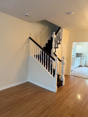 a view of entryway with wooden floor