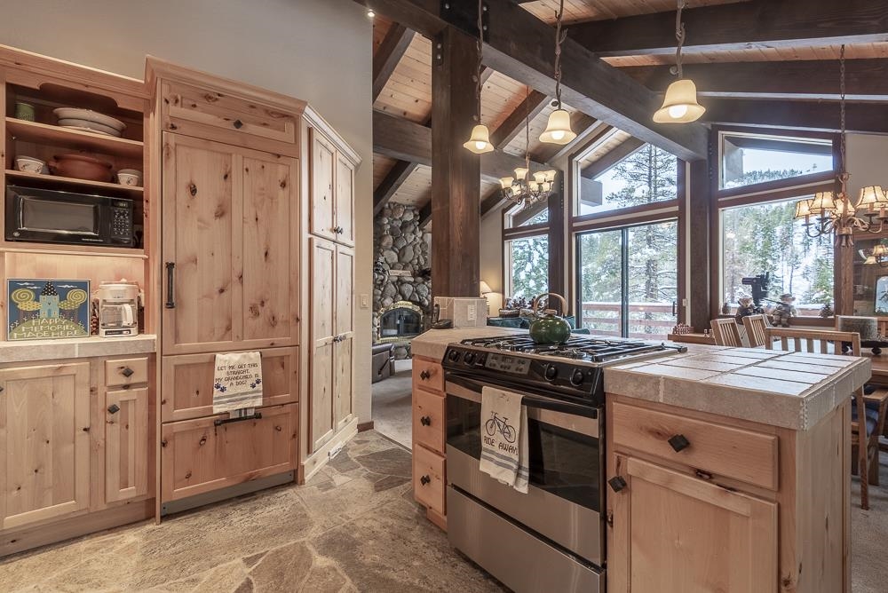 1380 Pine Trail Alpine Meadows, CA 96146 - Photo 11 of 21 a kitchen with stainless steel appliances granite countertop a stove and a refrigerator