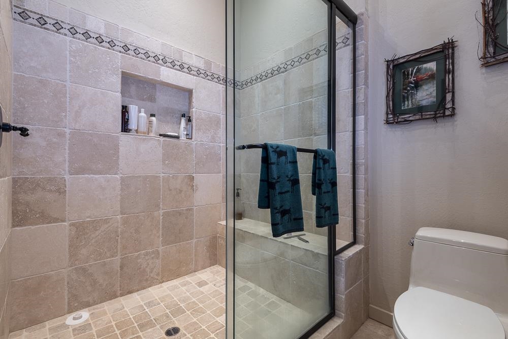 1380 Pine Trail Alpine Meadows, CA 96146 - Photo 16 of 21 a bathroom with a toilet and shower