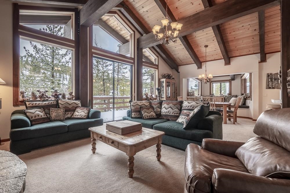 1380 Pine Trail Alpine Meadows, CA 96146 - Photo 6 of 21 a living room with furniture ceiling fan and a large window