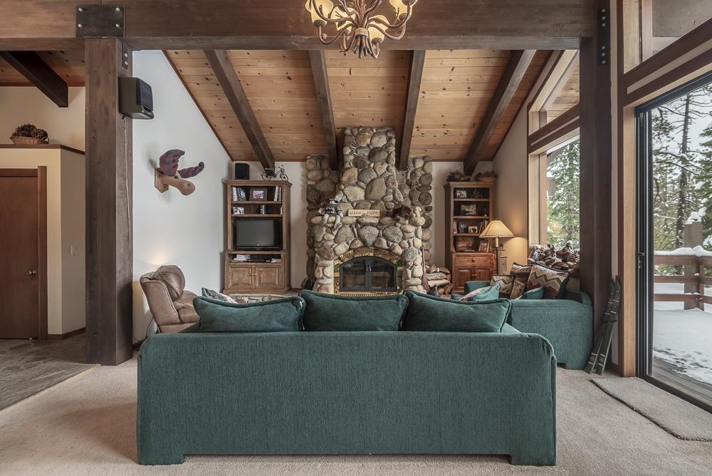 1380 Pine Trail Alpine Meadows, CA 96146 - Photo 7 of 21 a living room with furniture and a floor to ceiling window