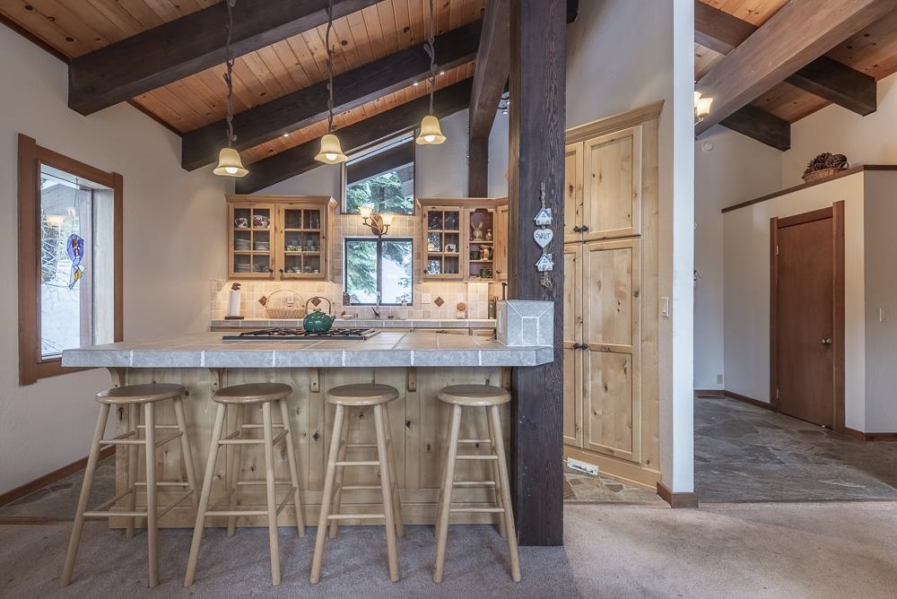 1380 Pine Trail Alpine Meadows, CA 96146 - Photo 10 of 21 a kitchen with a table and chairs