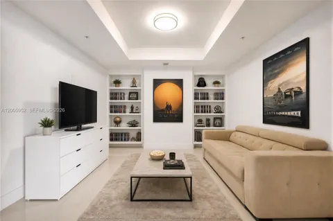 a bedroom with bed and a couch