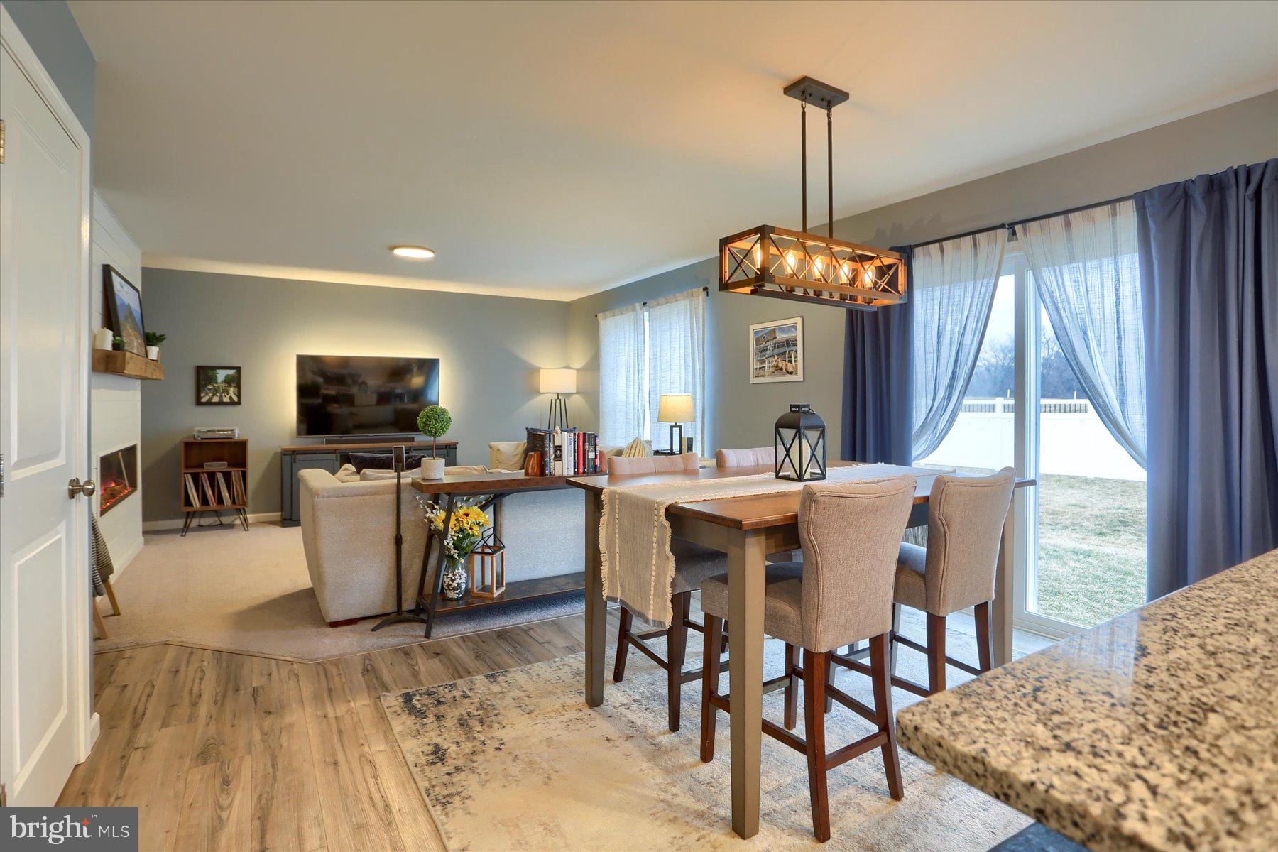 3480 Winter Drive Dover, PA 17315 - Photo 13 of 39 a view of a dining room with furniture window and wooden floor
