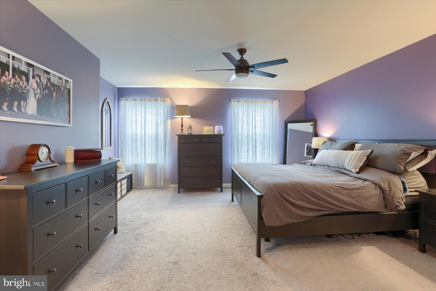3480 Winter Drive Dover, PA 17315 - Photo 29 of 39 a spacious bedroom with a bed and a chandelier