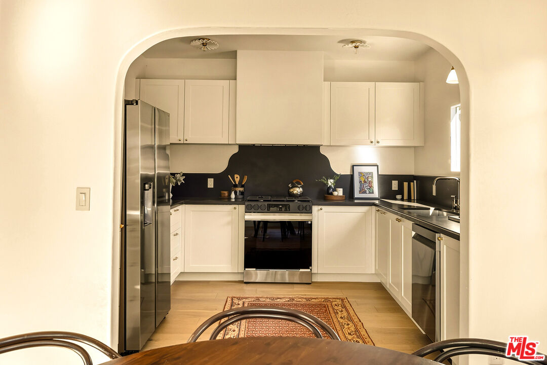 585 Mountain View Street Altadena, CA 91001 - Photo 13 of 31 a kitchen with a stove and a refrigerator