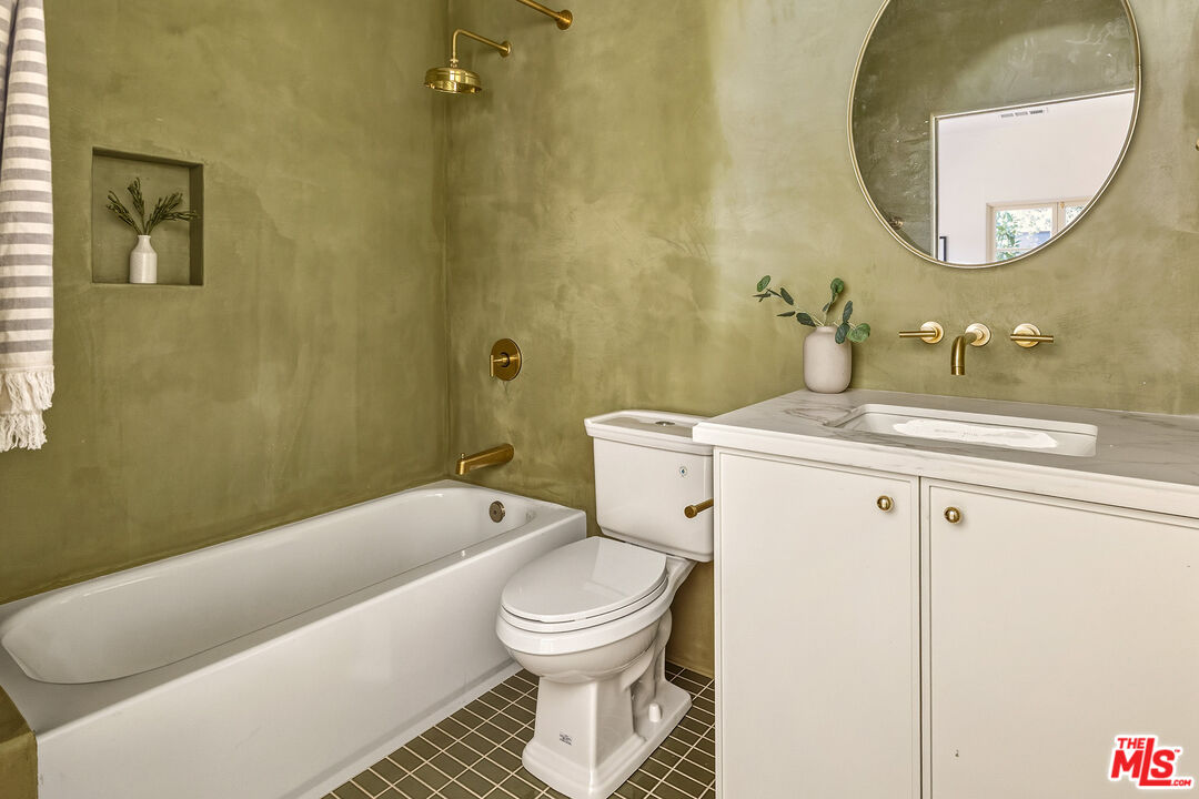 585 Mountain View Street Altadena, CA 91001 - Photo 17 of 31 a bathroom with a sink a toilet and a mirror