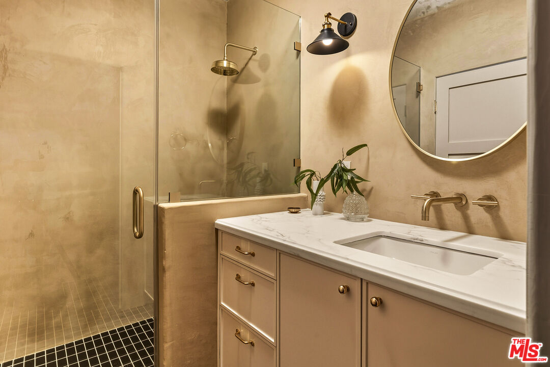 585 Mountain View Street Altadena, CA 91001 - Photo 21 of 31 a bathroom with a sink a vanity a mirror and a shower