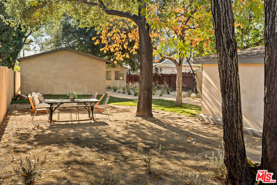 585 Mountain View Street Altadena, CA 91001 - Photo 31 of 31 a backyard of a house with table and chairs