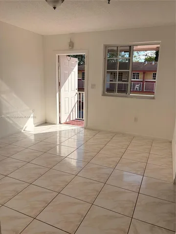a view of an empty room and window