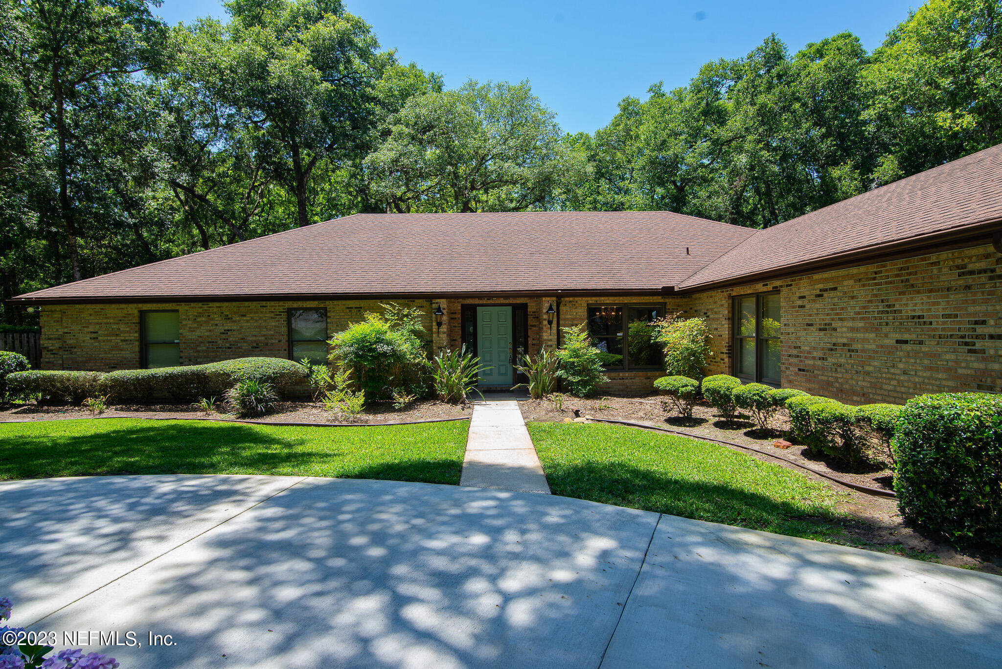 4233 Wicks Branch Road St. Augustine, FL 32086 - Photo 1 of 45 a front view of a house with a yard