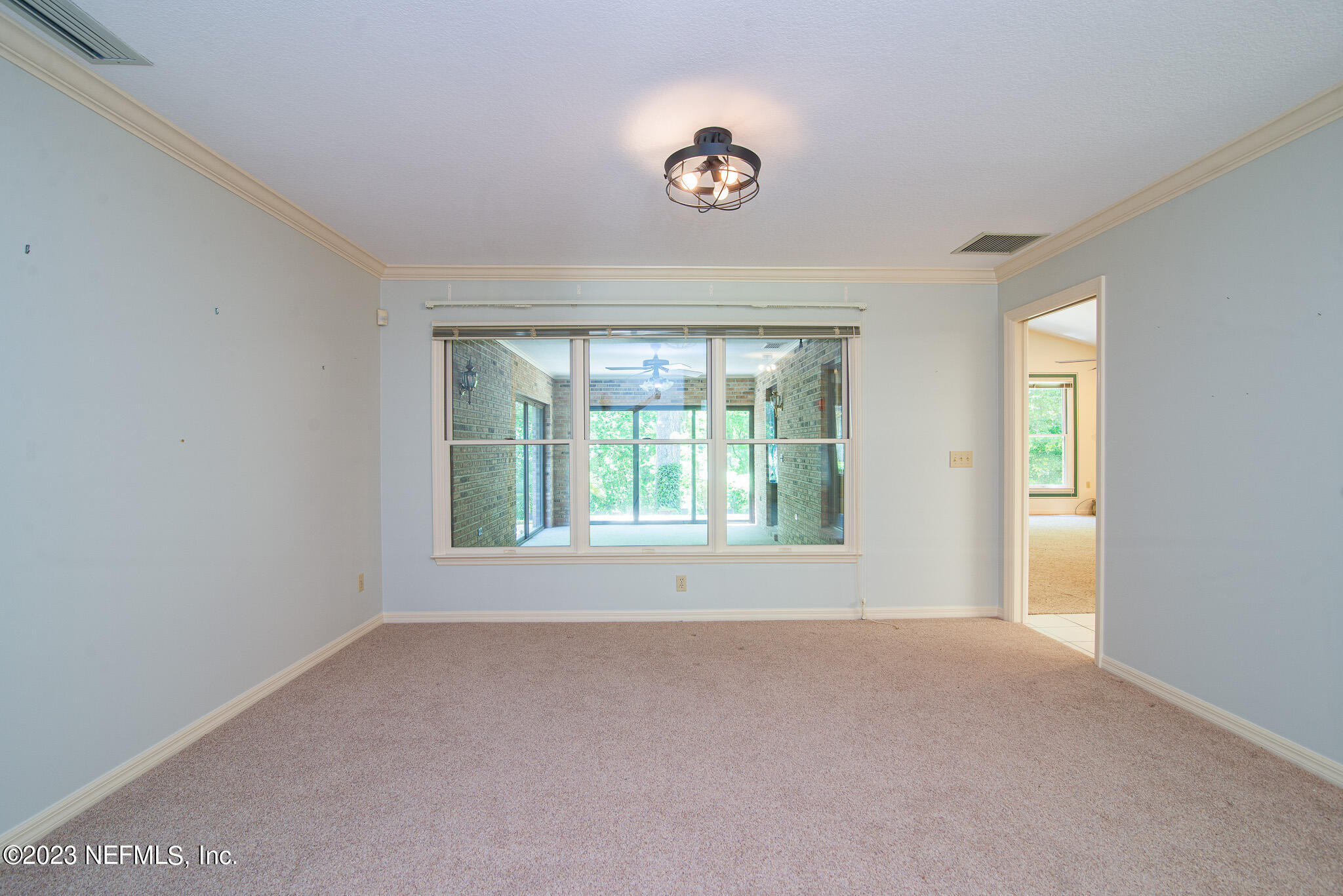 4233 Wicks Branch Road St. Augustine, FL 32086 - Photo 13 of 45 a view of an empty room with a window